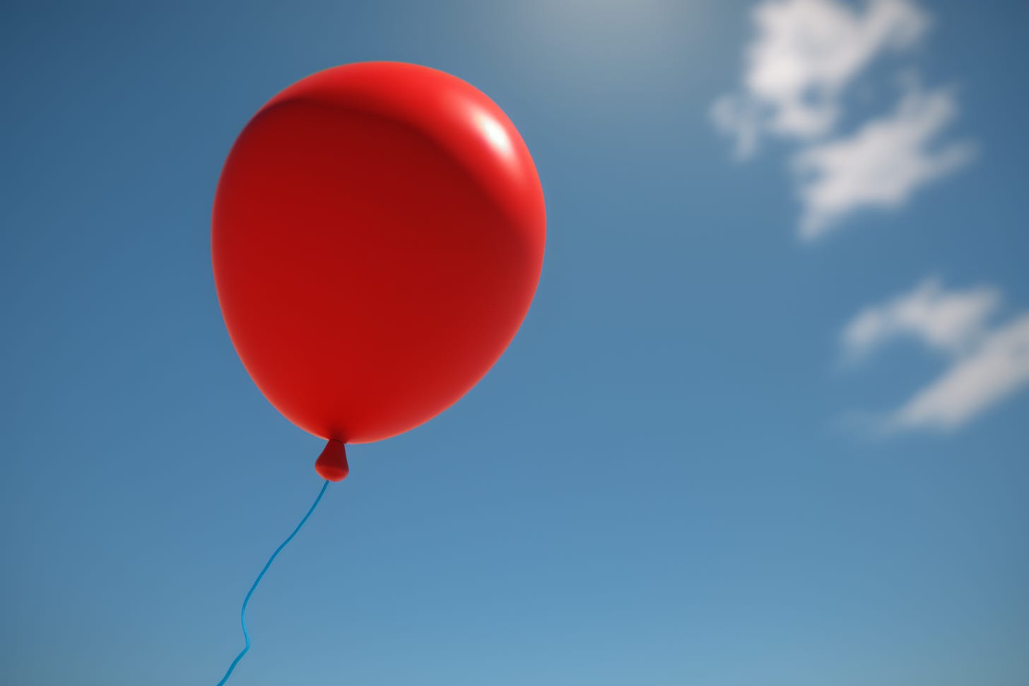 A red balloon in a blue sky, AI generated image.