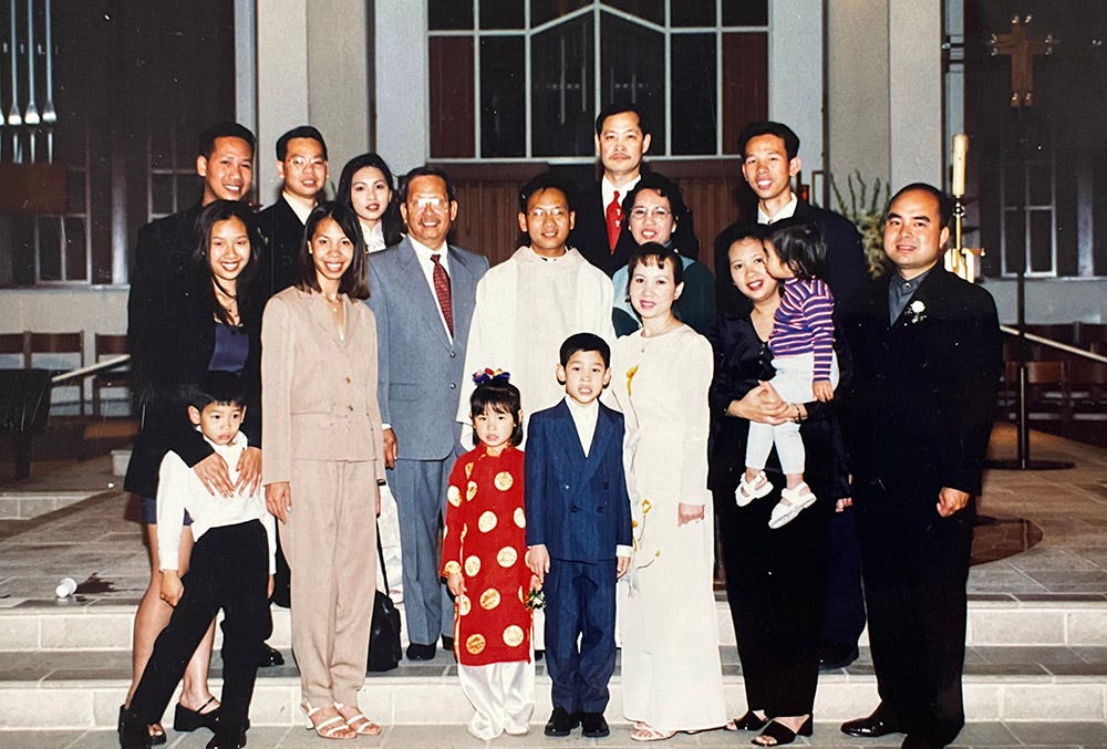 Then-Fr. Michael Pham (center) poses for a photo with his family at his ordination June 25, 1999. (Courtesy of San Diego Diocese) Then-Fr. Michael Pham (center) poses for a photo with his family at his ordination June 25, 1999. (Courtesy of San Diego Diocese)