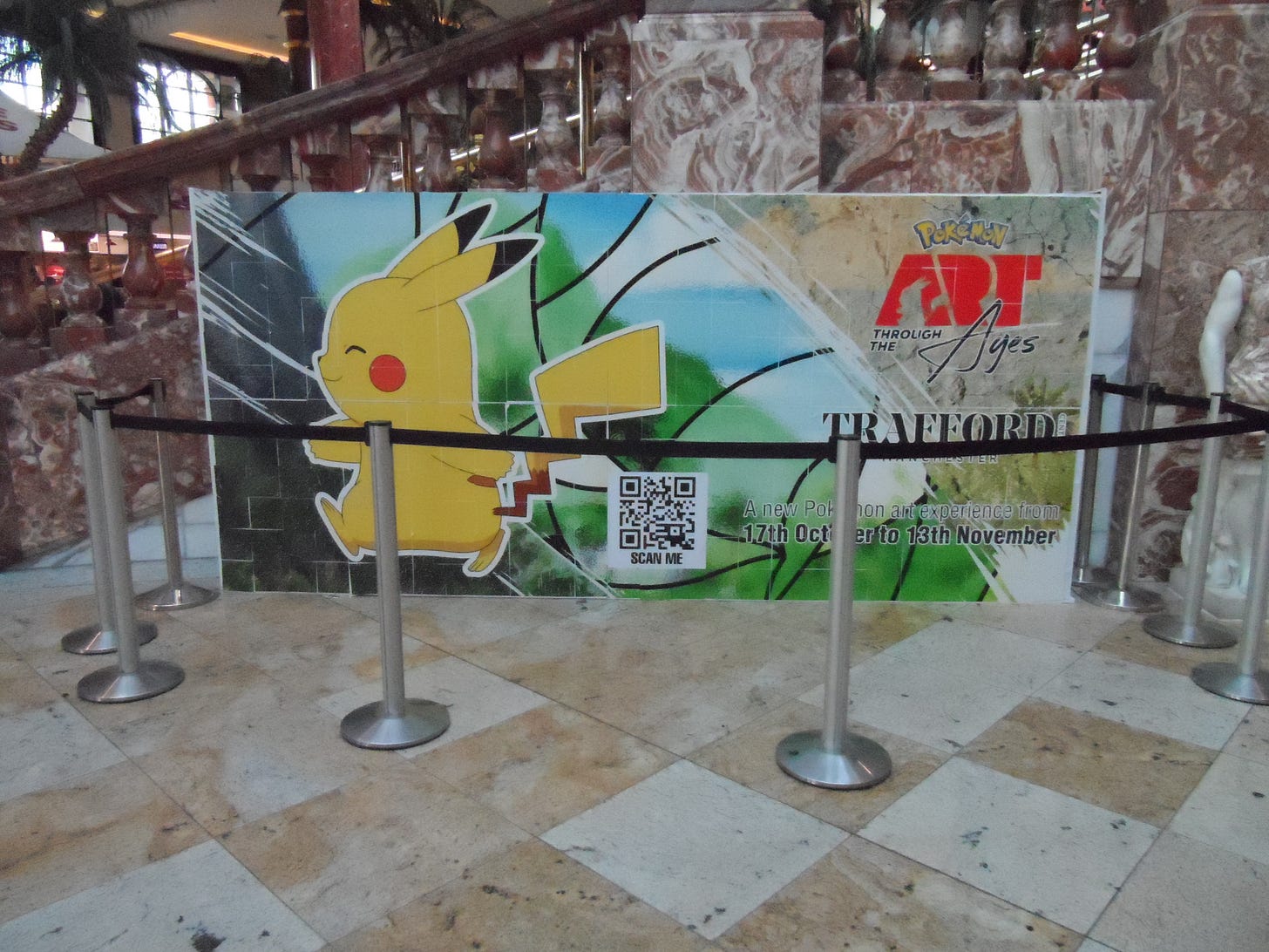 Visitors at the Trafford Center were greeted by this display, advertising the Pokémon: Art Through the Ages event