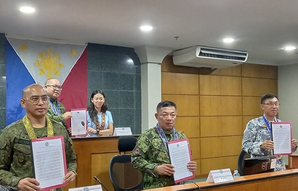 The officials of Regional Joint Peace and Security Coordinating Center (RJPSCC)-Western Visayas sign a resolution declaring Bacolod as insurgency free during its 2nd quarter meeting Friday, May 19, at the Bacolod City Government Center. (Merlinda Pedrosa photo)