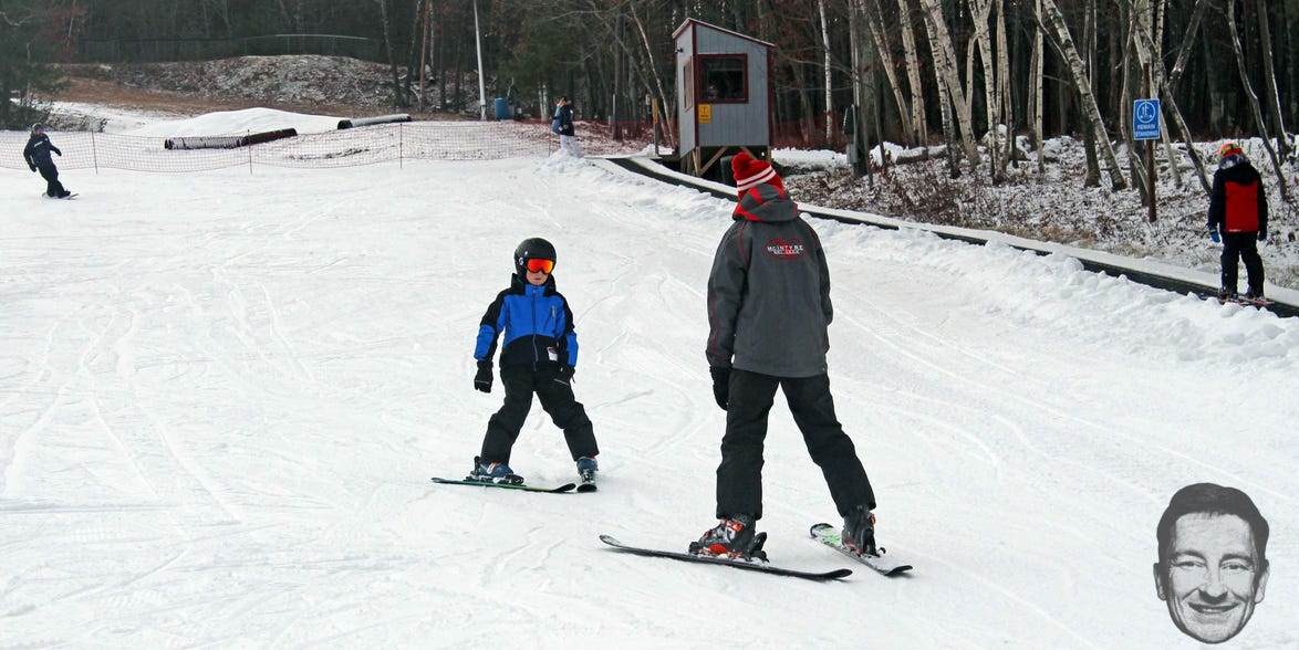 A ski instructor teaching a child at McIntyre Ski Area in Manchester, NH