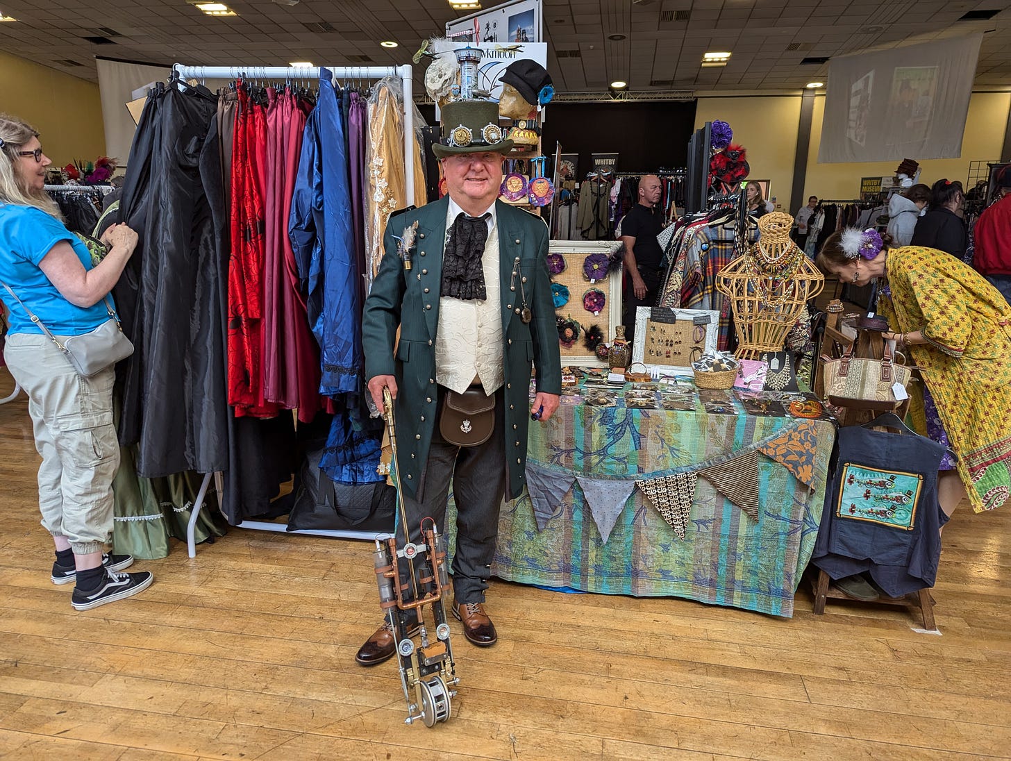 A steampunker poses for the camera inside a convention centre