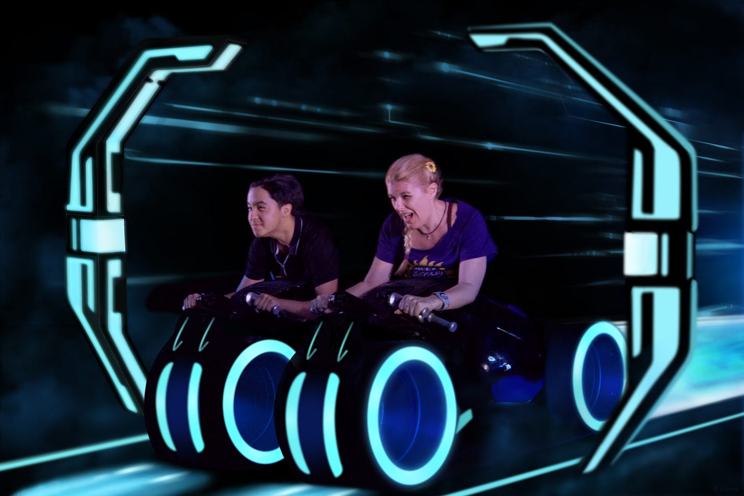 Cass riding TRON: Lightcycle Run and screaming a lot