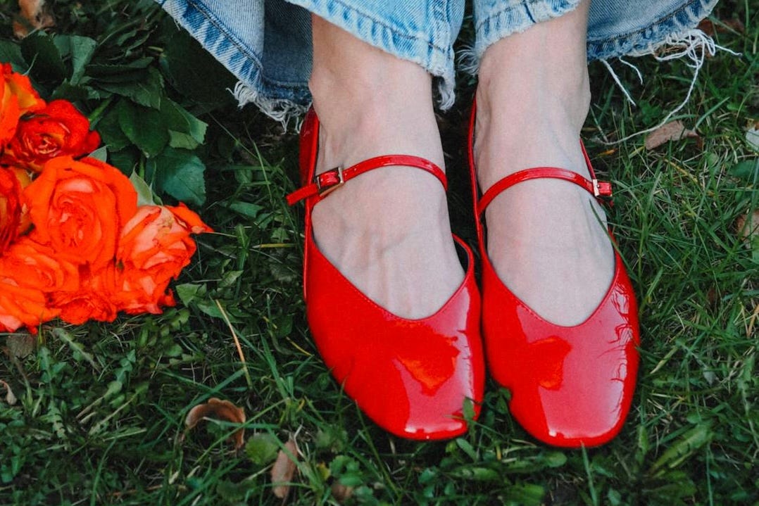 free-photo-of-woman-with-red-shoes-sitting-in-a-park.jpeg