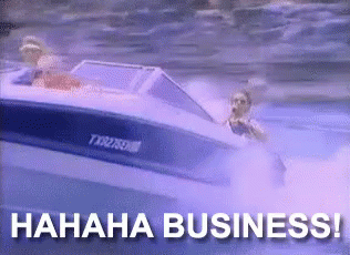 A man on a speed boat talking on the phone, and laughing - With the caption "HAHAH BUSINESS"