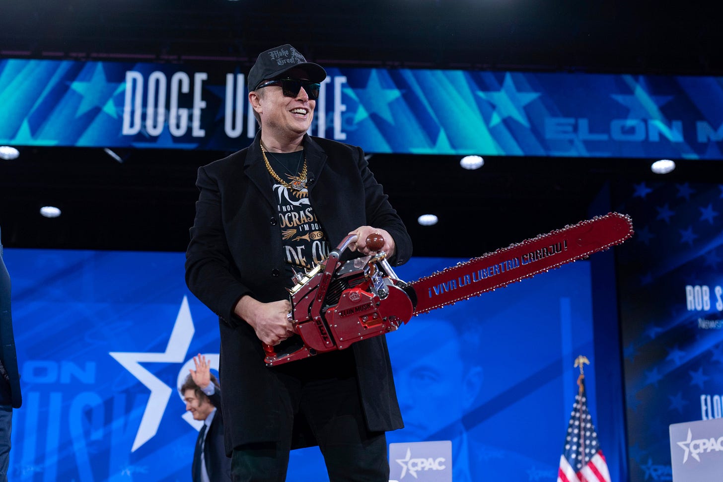 Elon Musk makes shocking appearance at CPAC with a chainsaw