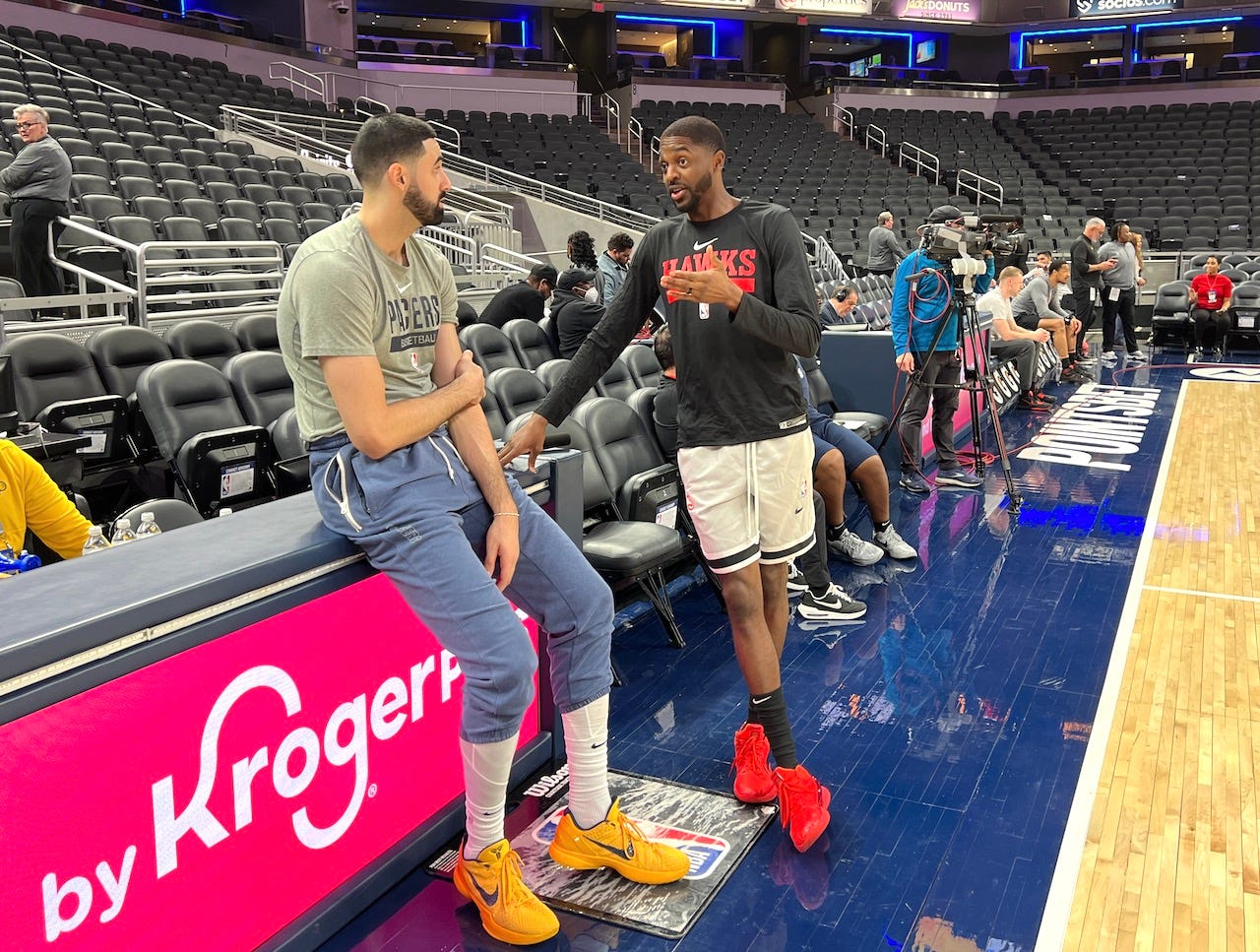 Former Pacers teammates Goga Bitadze and Justin Holiday catch up pregame.