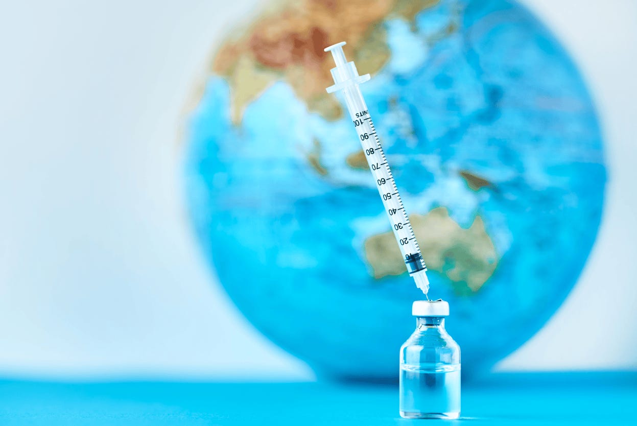 A syringe in a bottle with a globe in the background

Description automatically generated