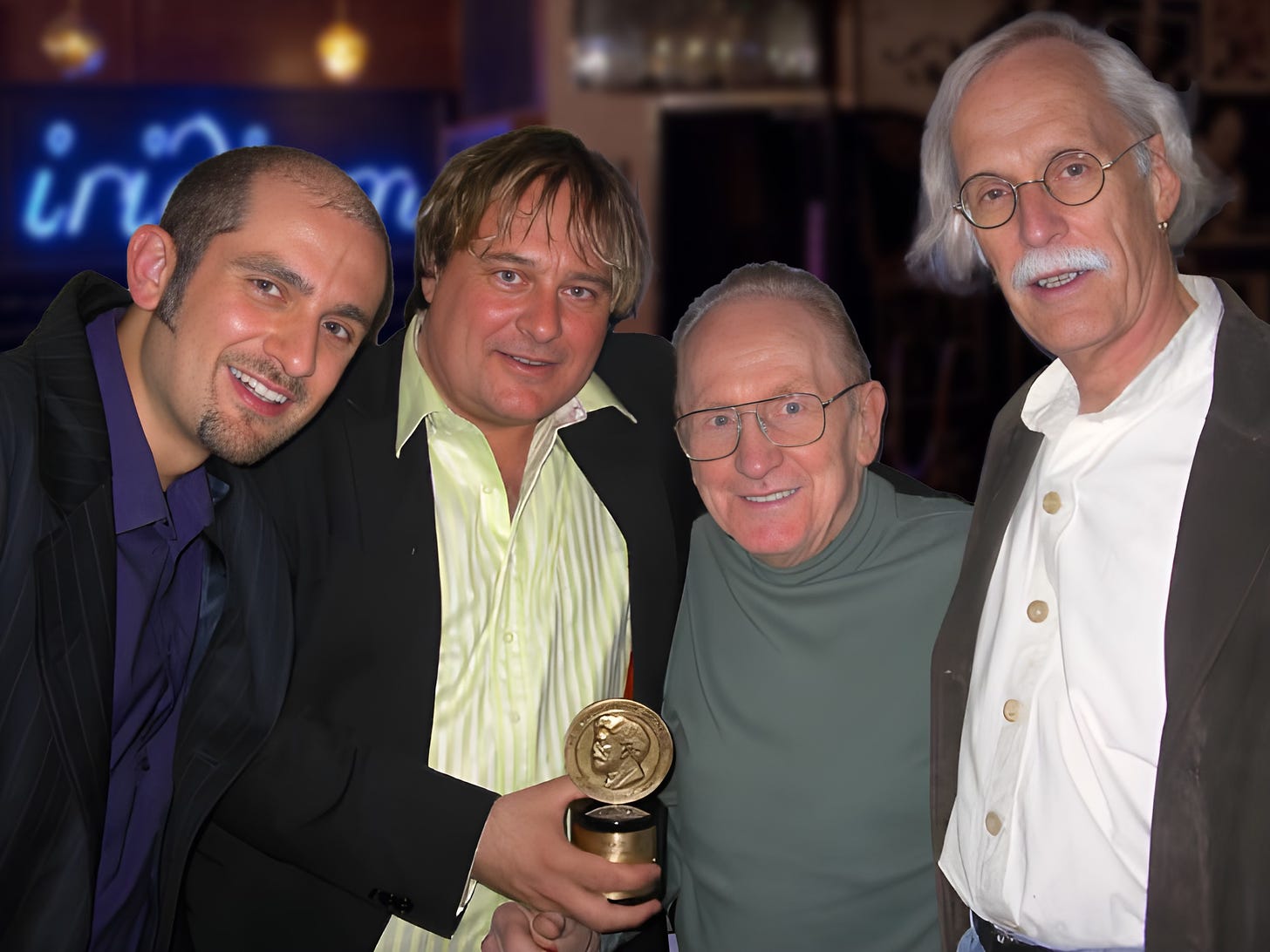 Paolo Pietropaolo, Jowi Taylor, Les Paul and Chris Brookes backstage at the Iridium Club in NYC, Jowi and Les holding the Peabody Award