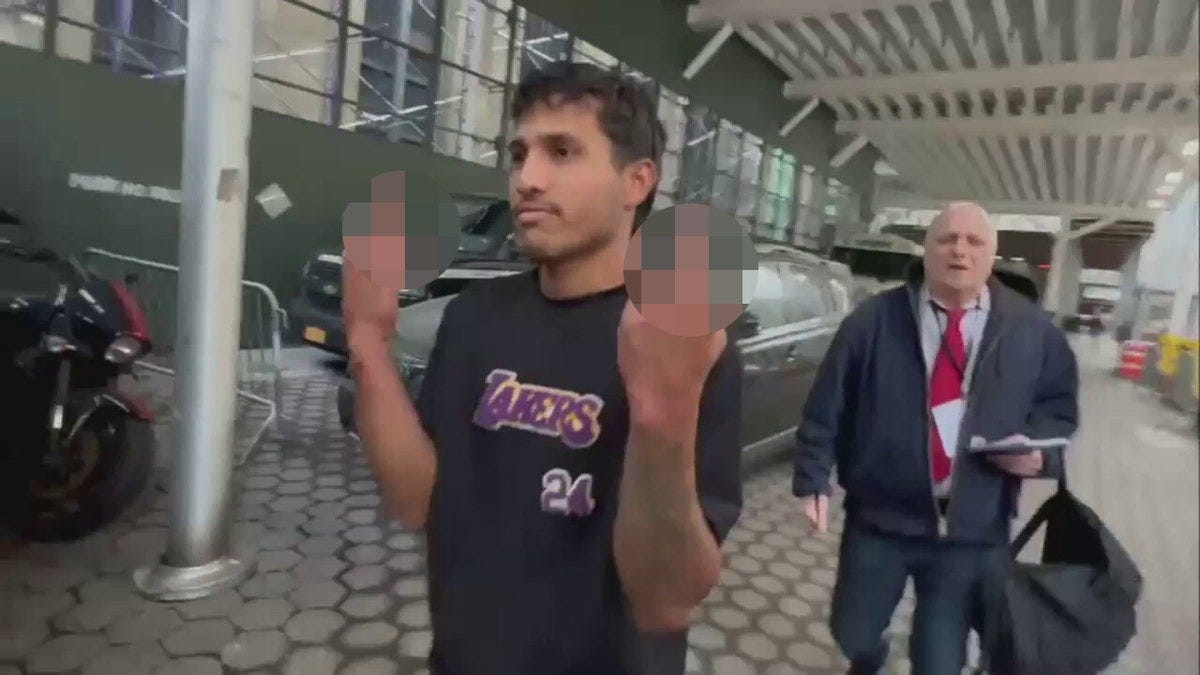 Migrant gives middle finger after arrest for attacking police | Fox News
