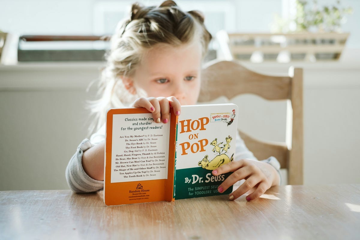 Child reading a book.