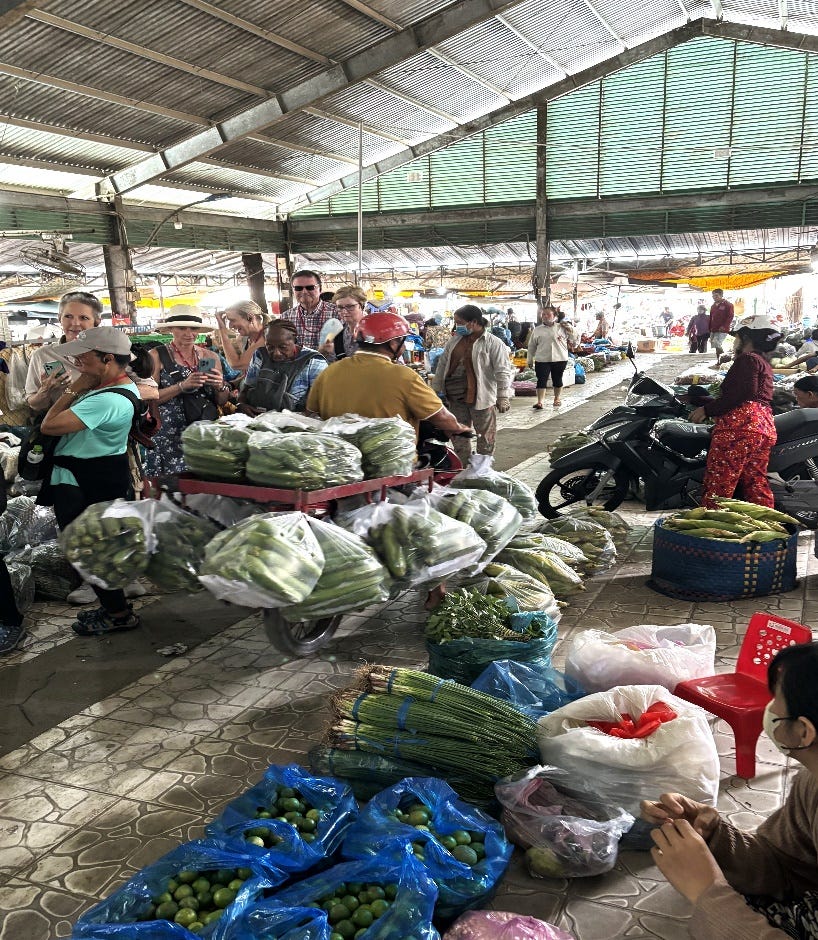 A group of people in a market A group of people in a market
