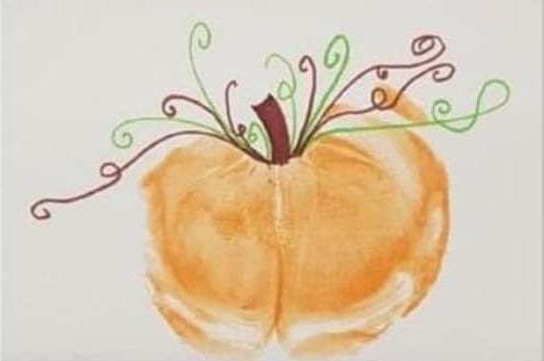 a pumpkin painting where the pumpkin is an orange baby bum print