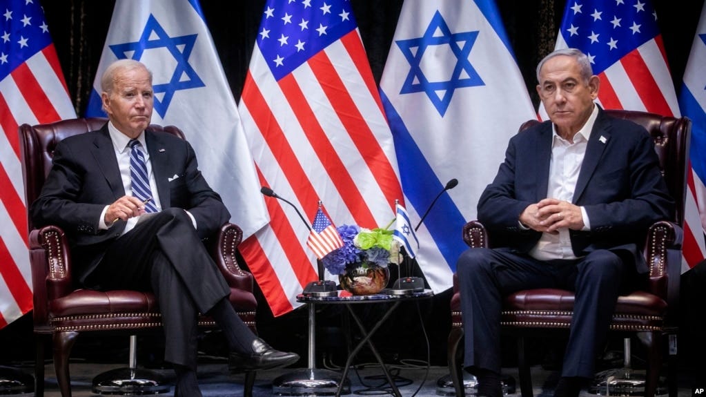 FILE - U.S. President Joe Biden, left, pauses during a meeting with Israeli Prime Minister Benjamin Netanyahu, in Tel Aviv, Israel, Oct. 18, 2023.