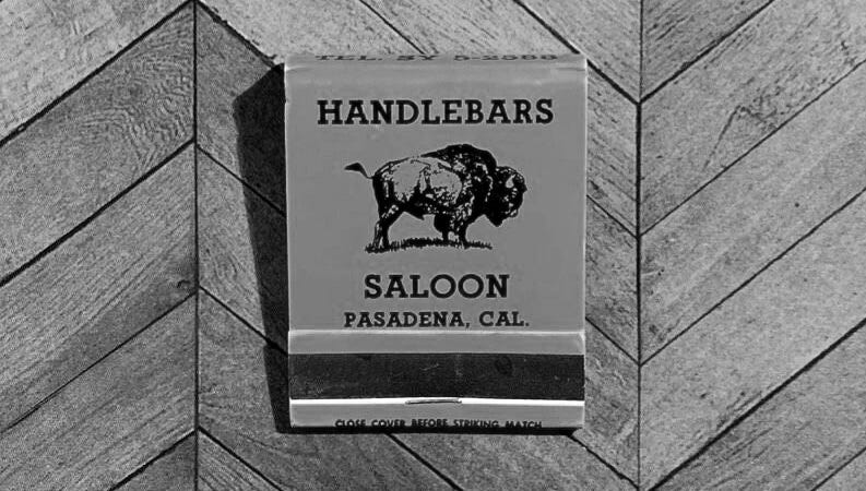 A black and white matchbook of the Handlebars Saloon