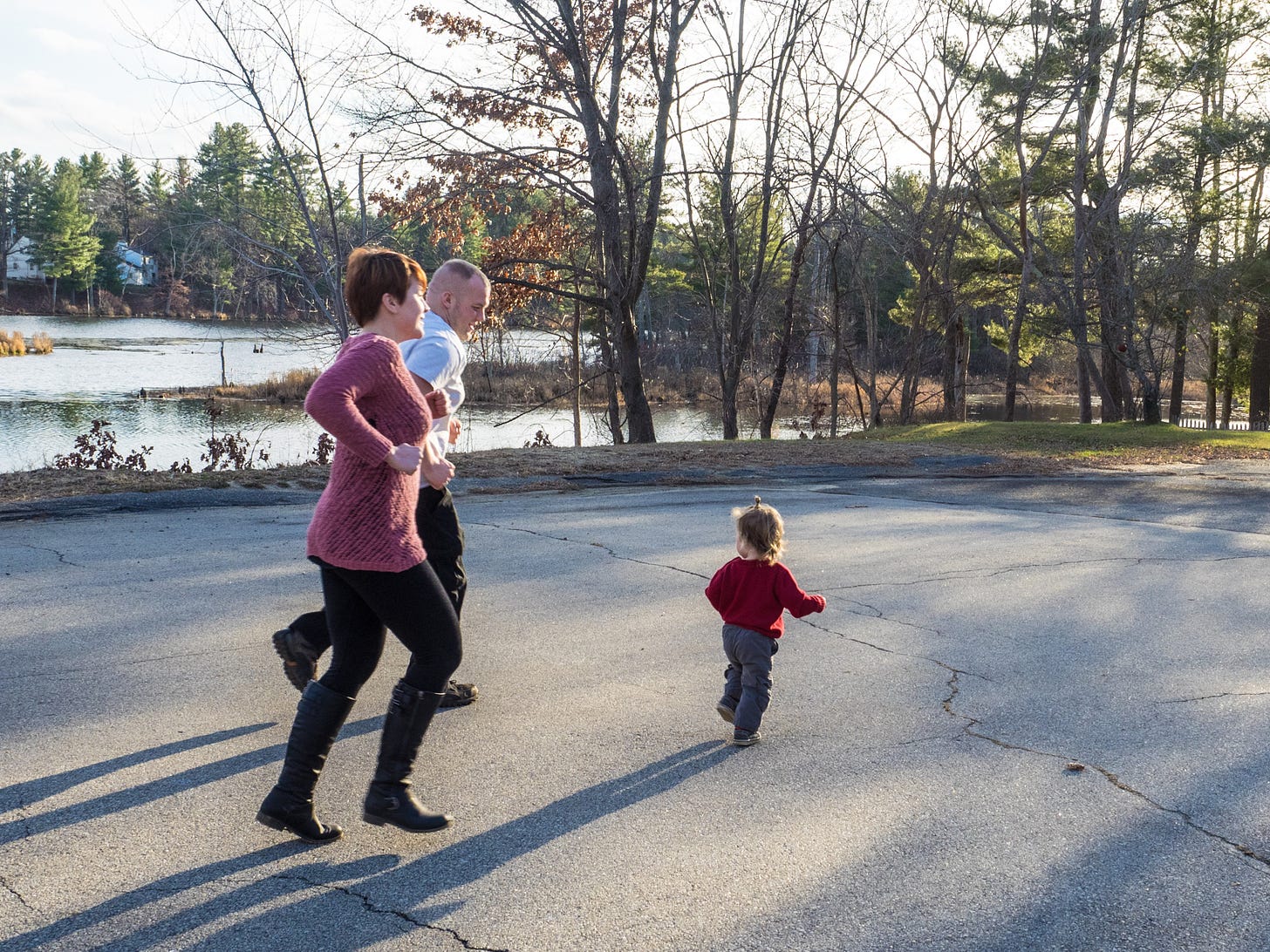 Couple jogging with their son on Thankgving day