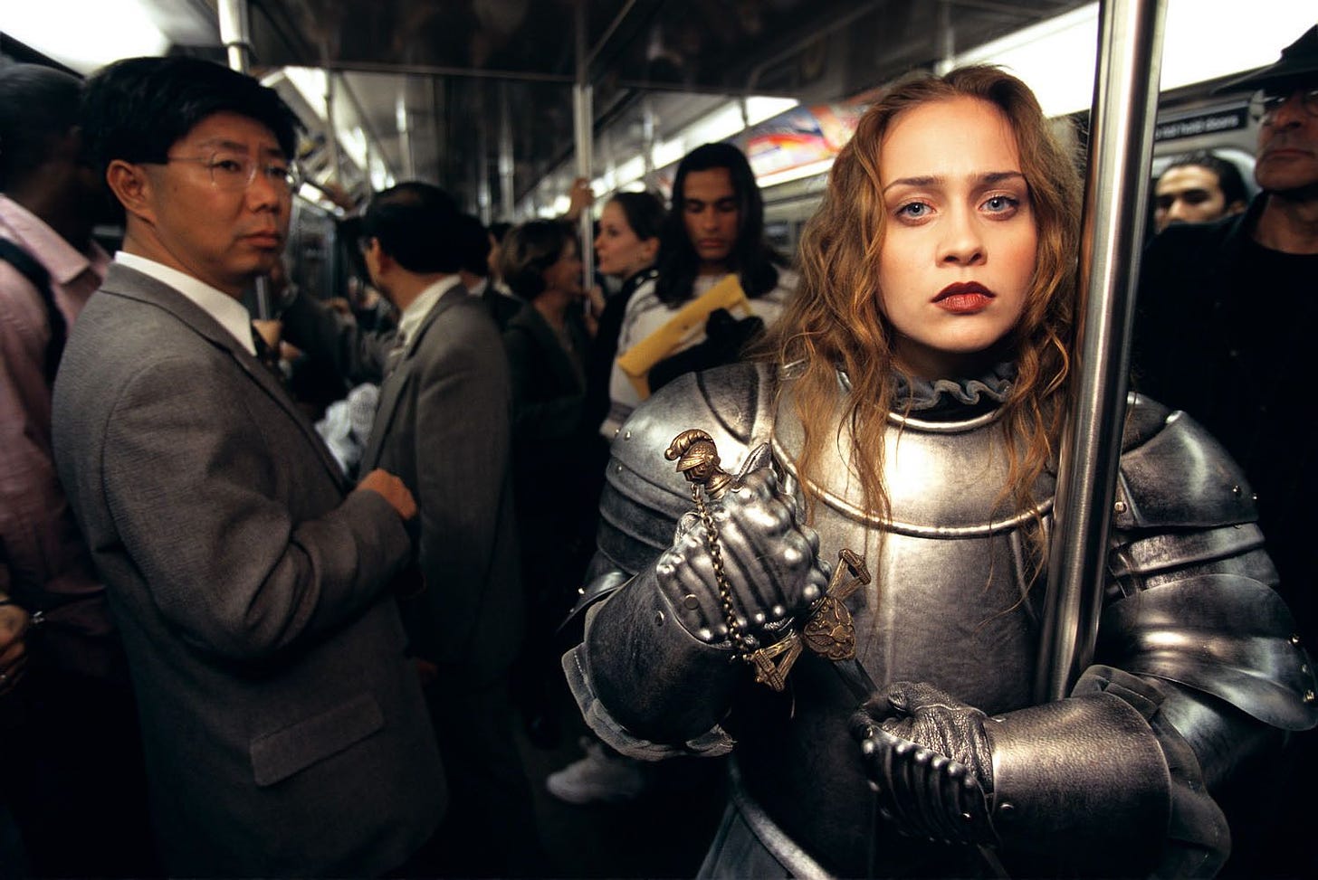 Fiona Apple wearing suit of armor on subway - by Joe McNally ...