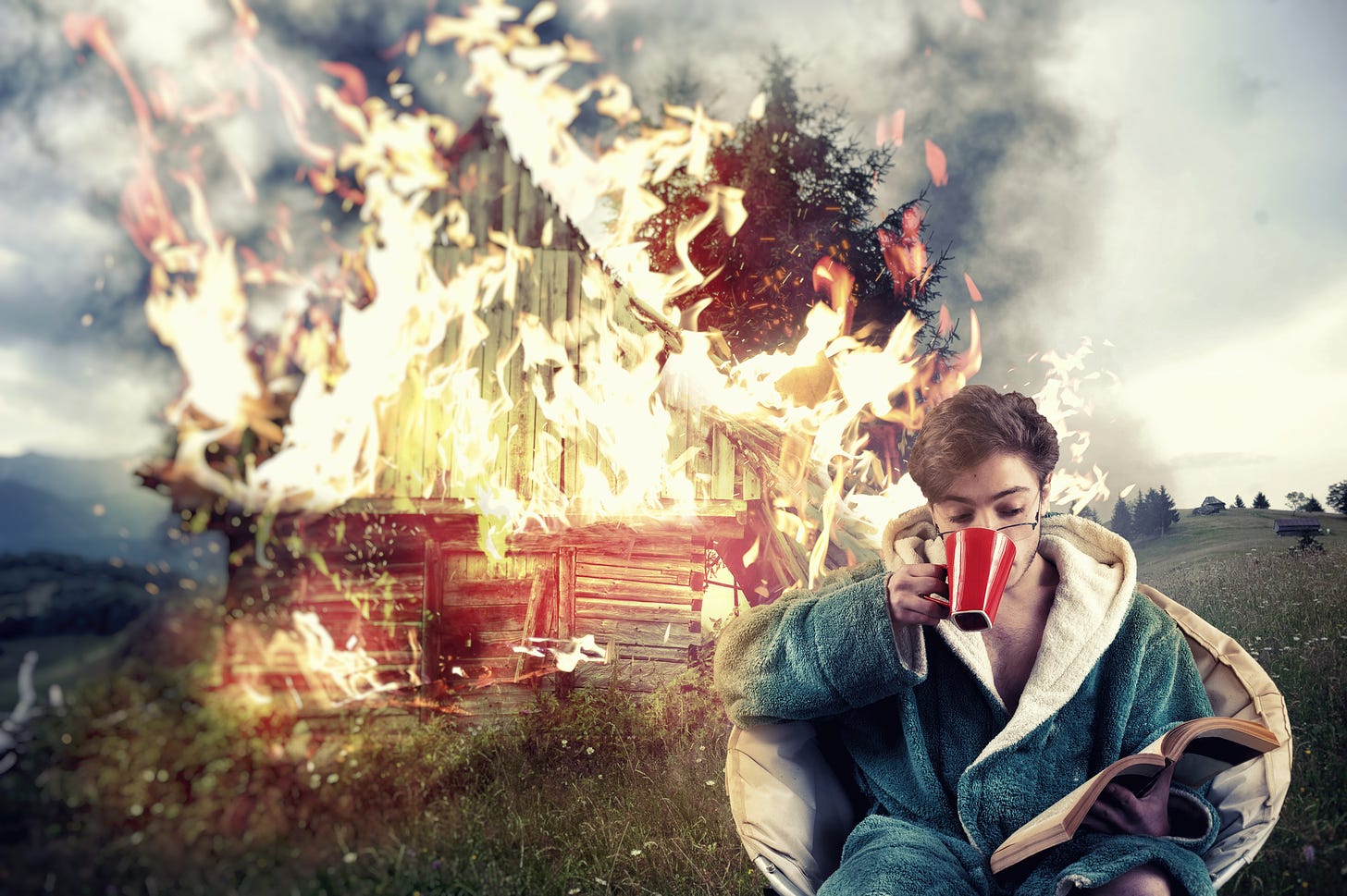Image of a man in a chair reading and drinking coffee while a house is on fire right behind him.