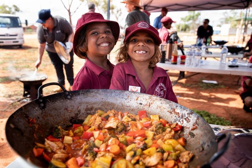 May be an image of 6 people and paella