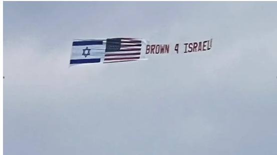May be an image of aircraft and text that says 'BROWN 4 ISRAEL!'