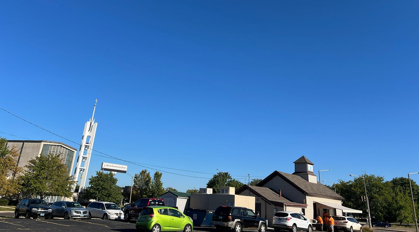 Cars are seen lining up at a food pantry.