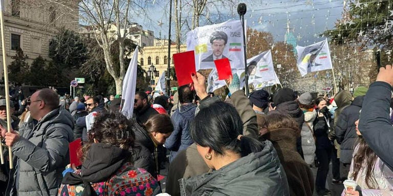 Protesters in Georgia took to the streets with red cards.