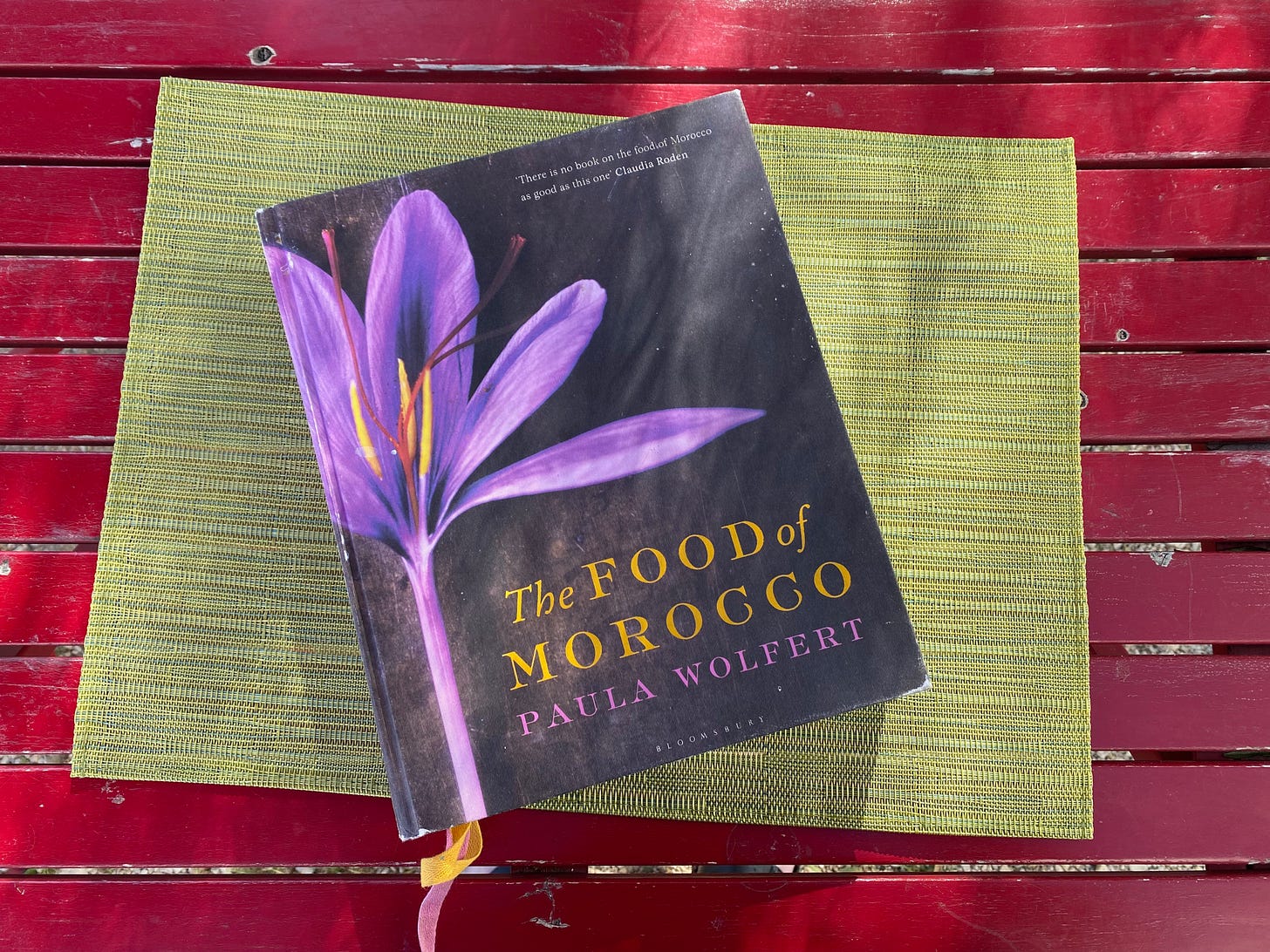Picture of the cook book - The Food of Morocco - Paula Wolfert on an outside table.