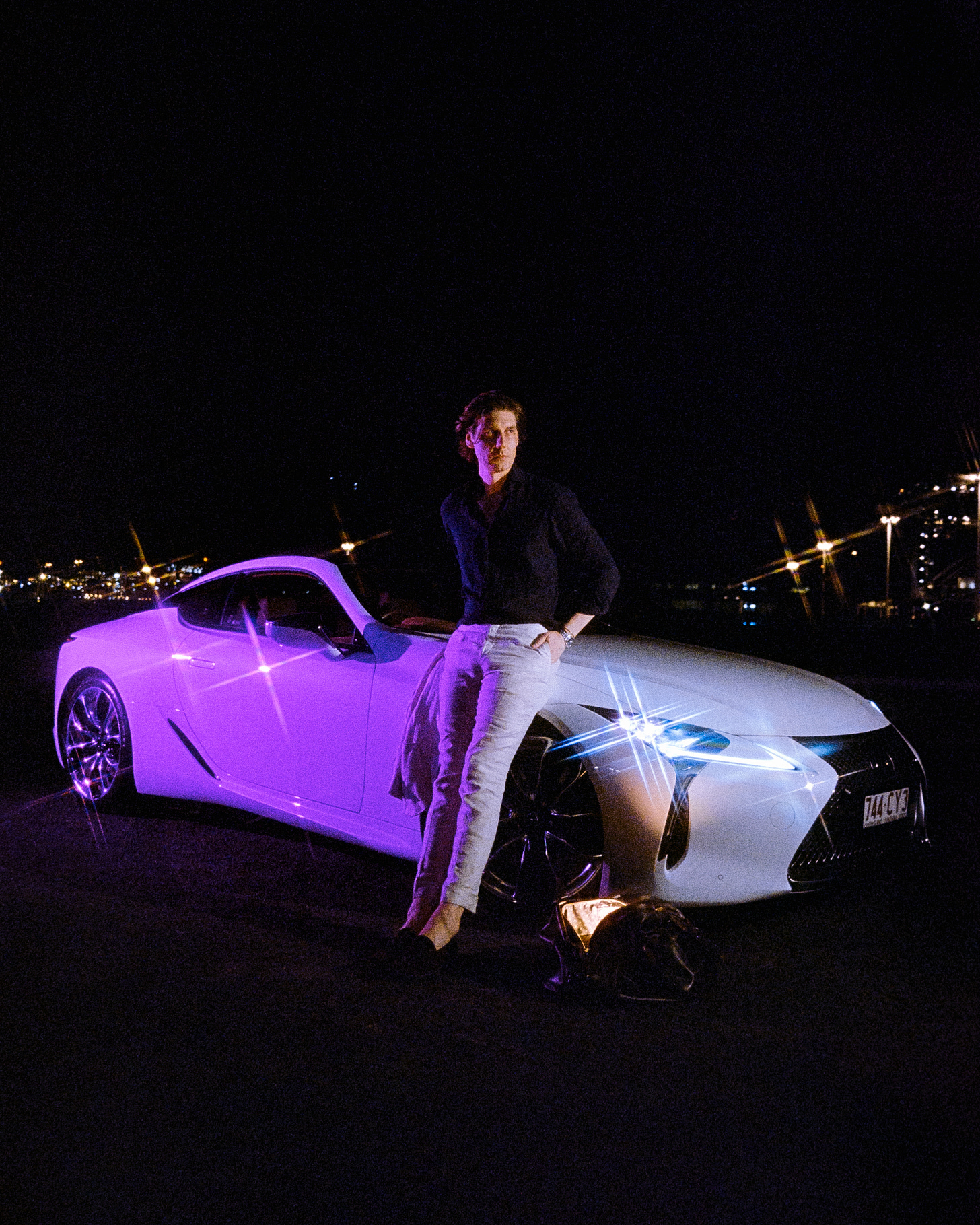 A wide angle shot of Clem and his Car, complete with purple light, lots of starbursts and the glowing duffle bag at his feet