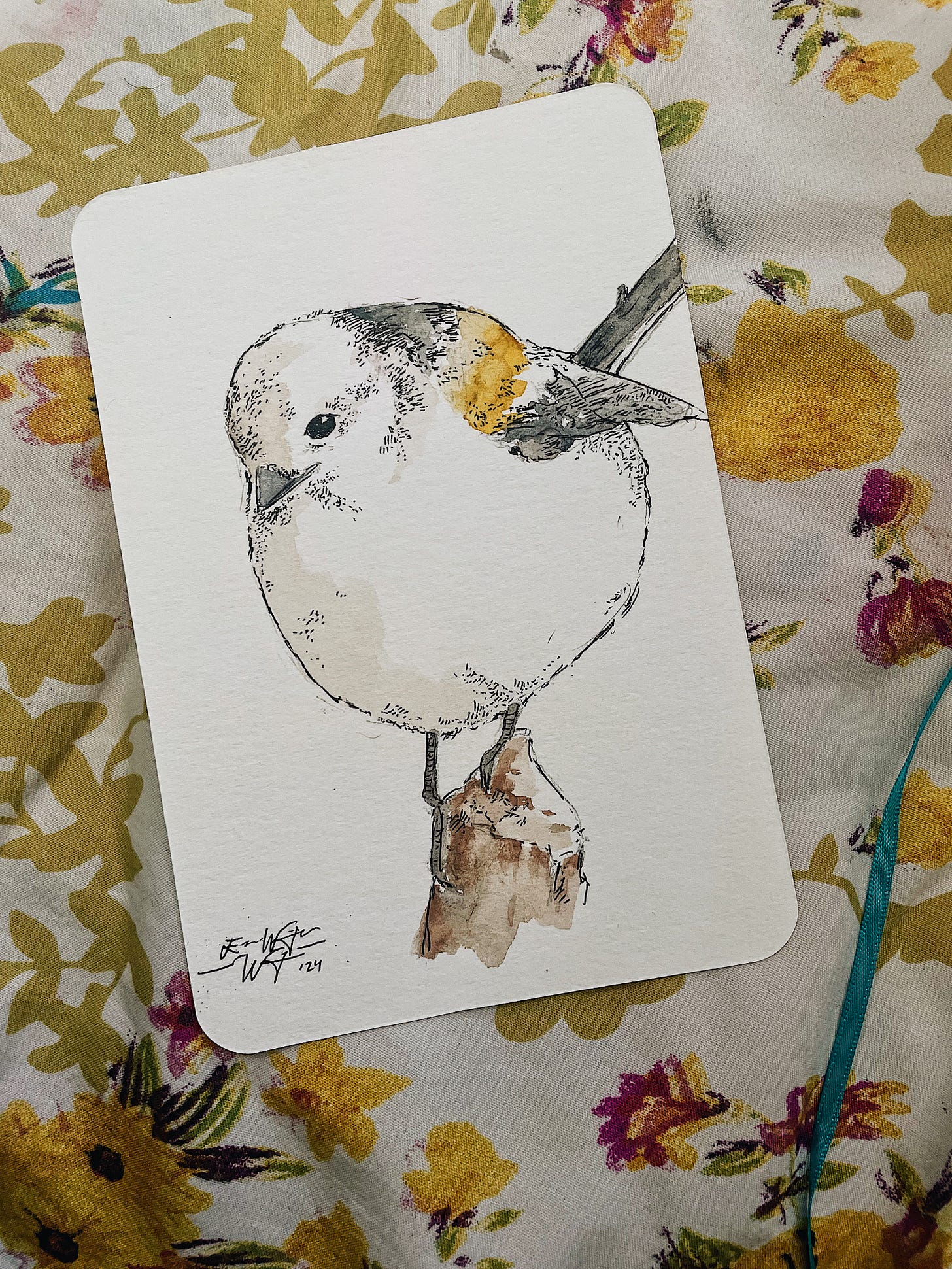 a watercolor painting of a snow fairy bird on a postcard