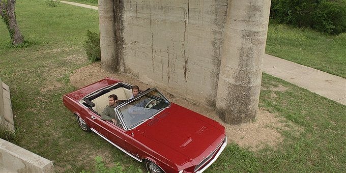 Walker Cordell and Hoyt in red convertible.