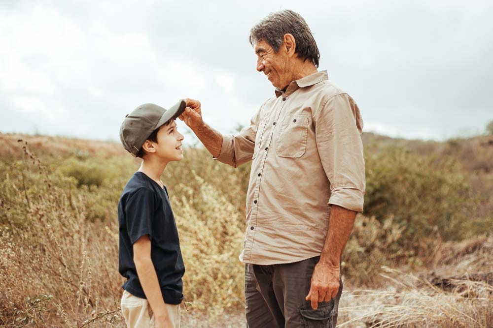 Grandfather and grandson exploring the outdoors together.