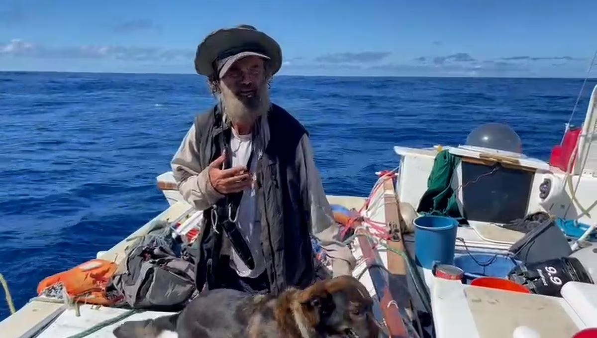 Tim Shaddock and Bella on their catamaran shortly after being found