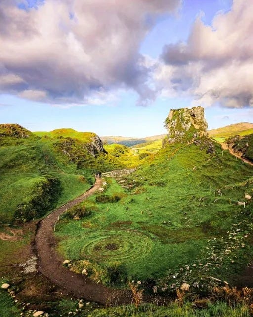 May be an image of Arthur's Seat, grass, the Carrick-a-Rede Rope Bridge and nature