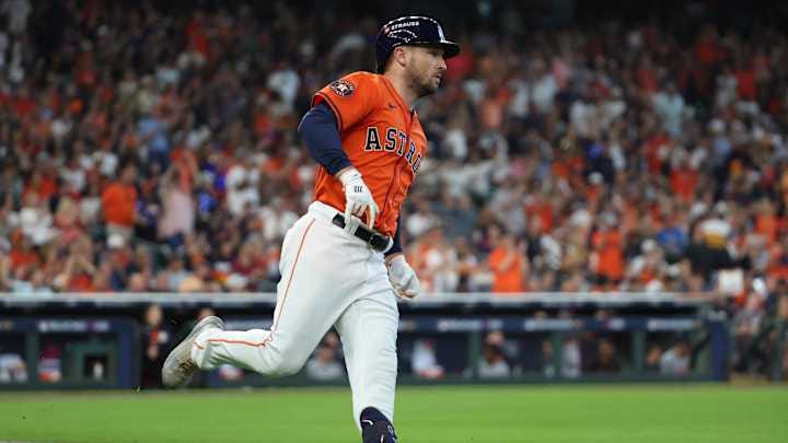 Oct 2, 2024; Houston, Texas, USA; Houston Astros third base Alex Bregman (2) runs after hitting a single against the Detroit Tigers during the second inning of game two of the Wildcard round for the 2024 MLB Playoffs at Minute Maid Park. 