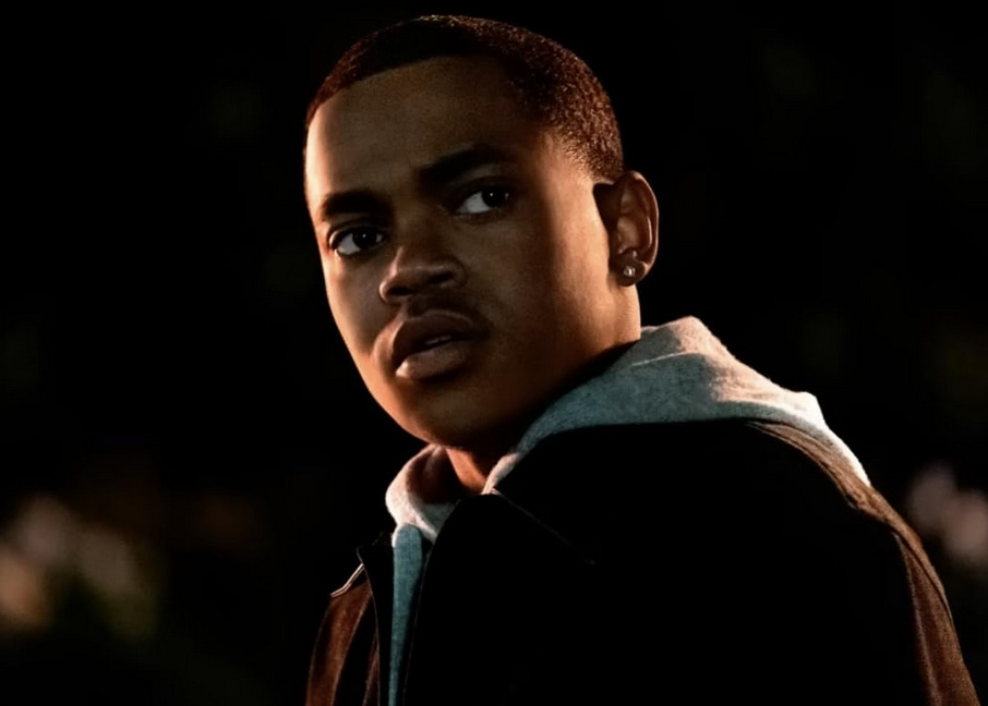 Michael Rainey Jr in Power Book II: Ghost; he is standing outside at night, wearing a dark jacket, looking towards the camera with a serious expression