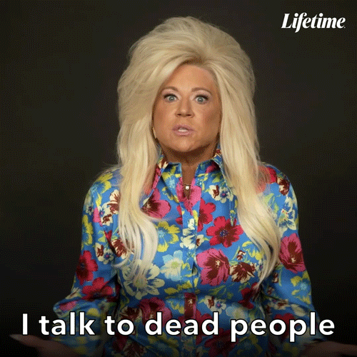 A woman shrugs and says I talk to dead people.