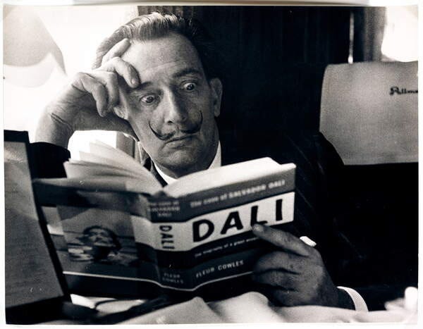 Photography Salvador Dali reading his biography, 6 May, 1959