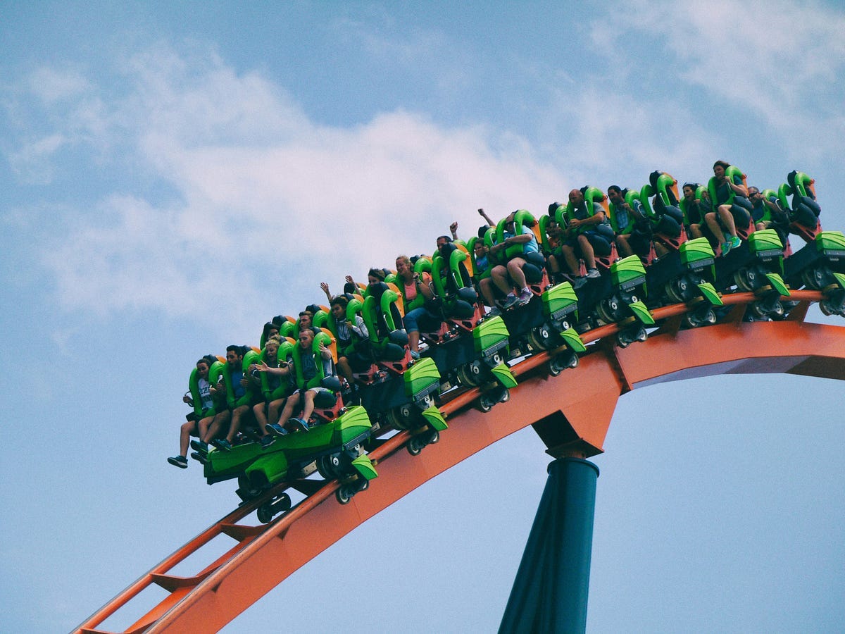 People on a roller coaster ride.