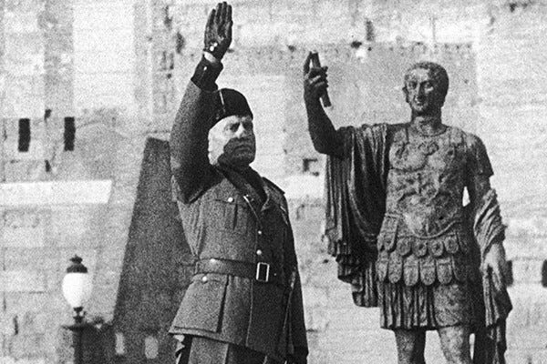 Mussolini salutes in front of the statue of the Roman emperor Nerva, in the 1930s