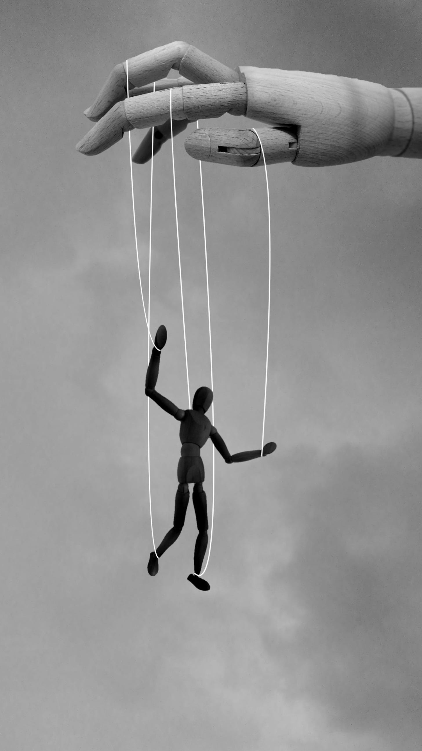 a person being pulled by strings 