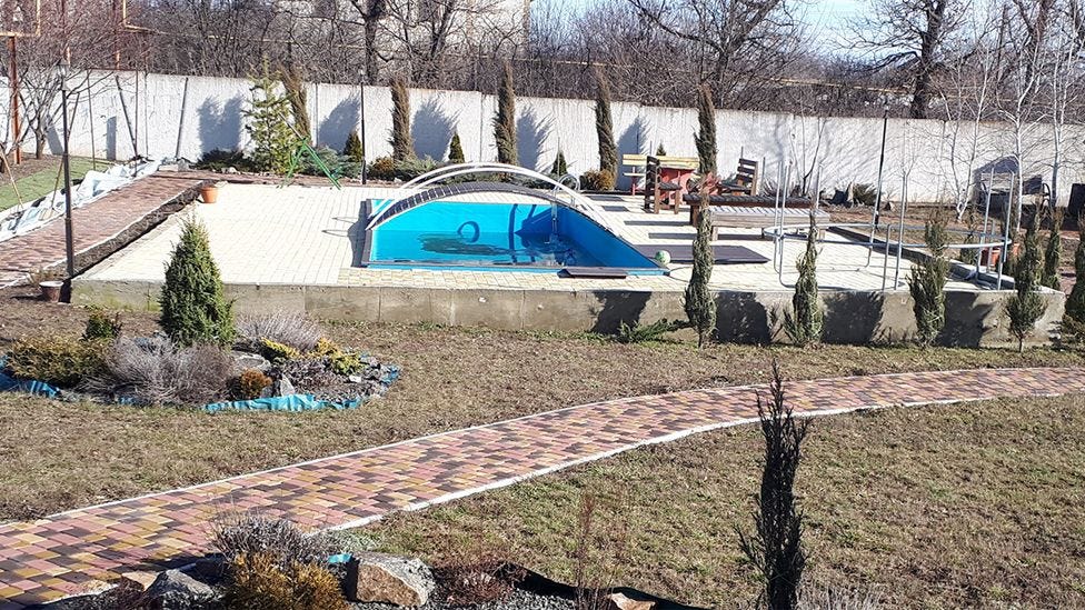 Marina’s swimming pool and garden next to her house