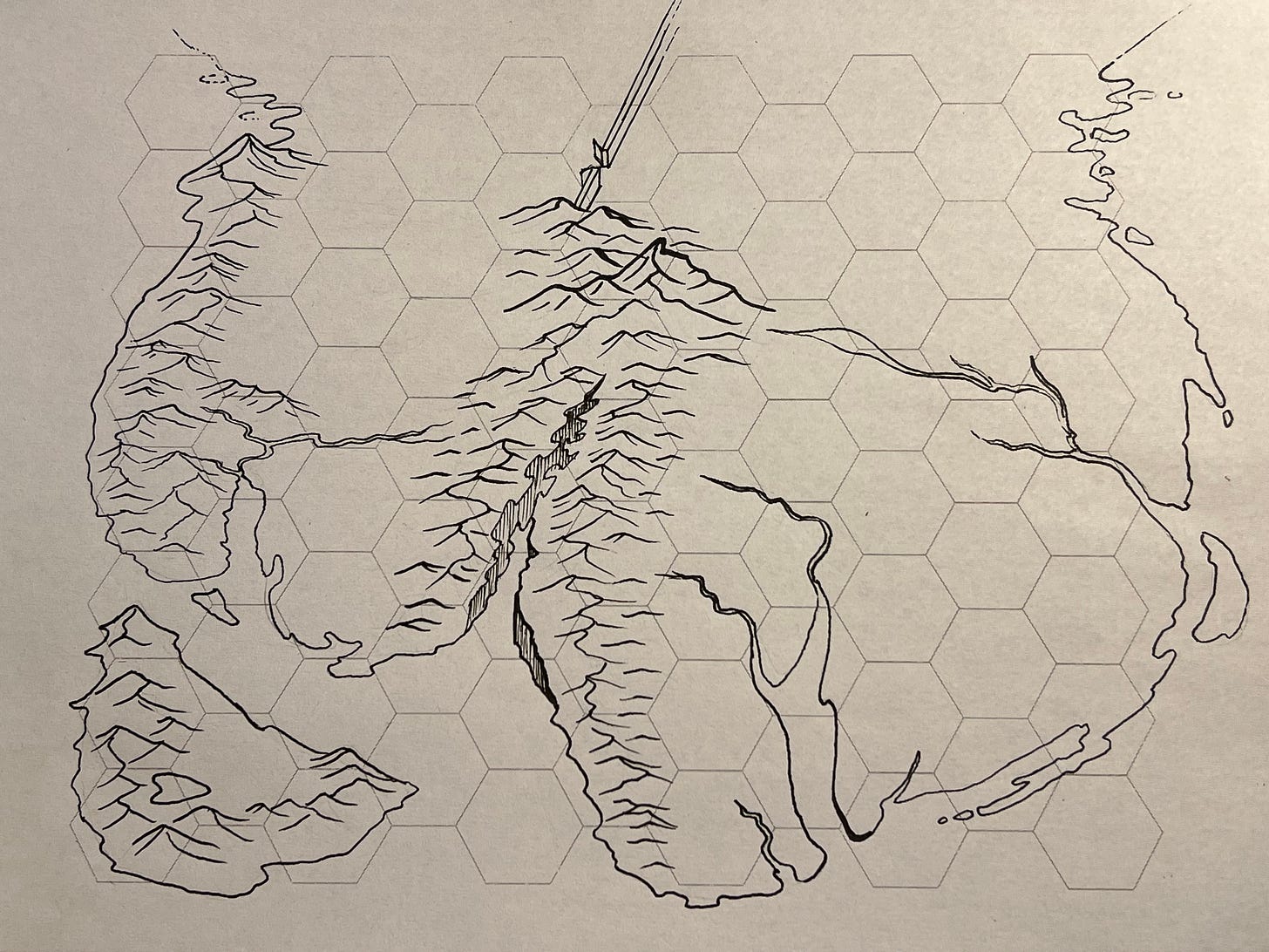 A light grey hex grid with black ink in the form of a map with mountains and the boundaries marked. 