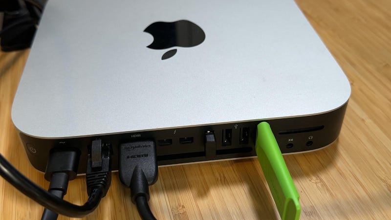 Connected mac mini for setup. keyboard dongle on left-most USB port