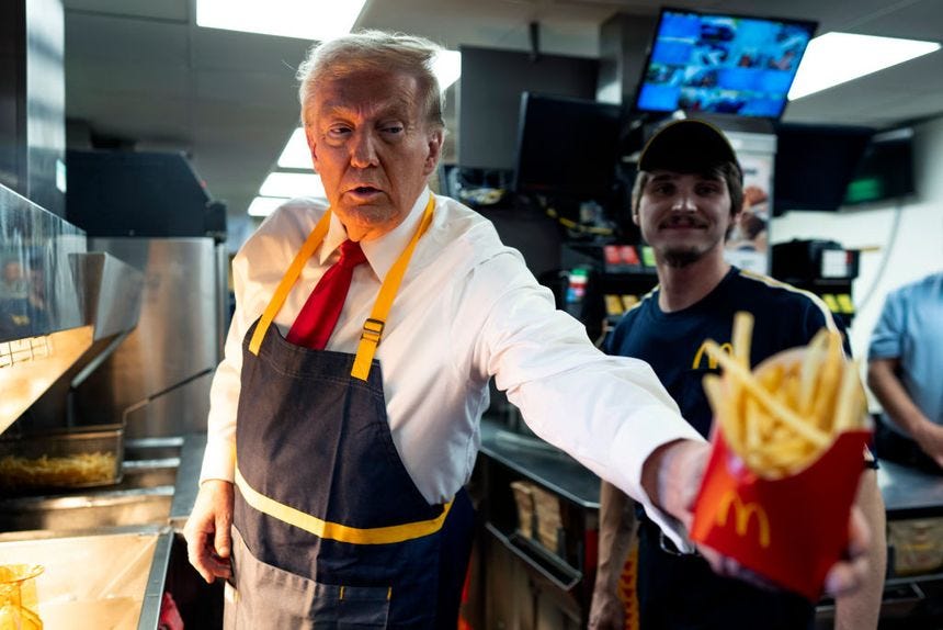 Republican presidential nominee, former U.S. President Donald Trump works behind the counter during a visit to McDonald's restaurant in Feasterville-Trevose, Pa., on Oct. 20, 2024.