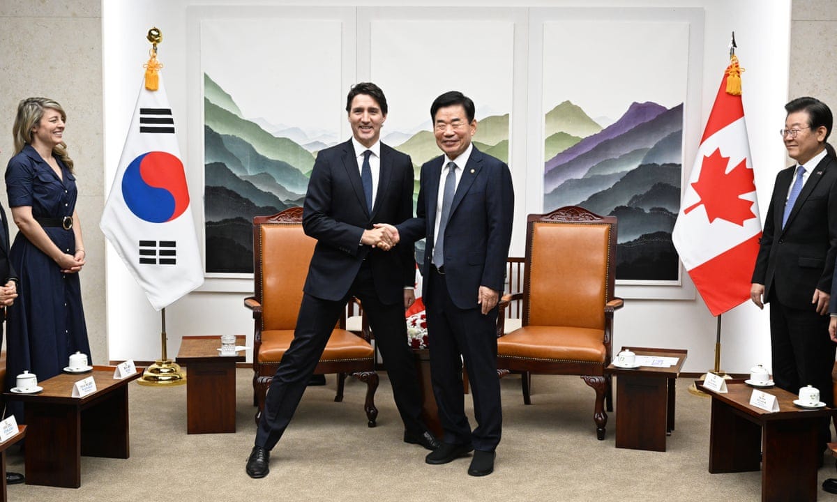 Trudeau's wide-stance pose with Korean politician splits critics | Justin  Trudeau | The Guardian