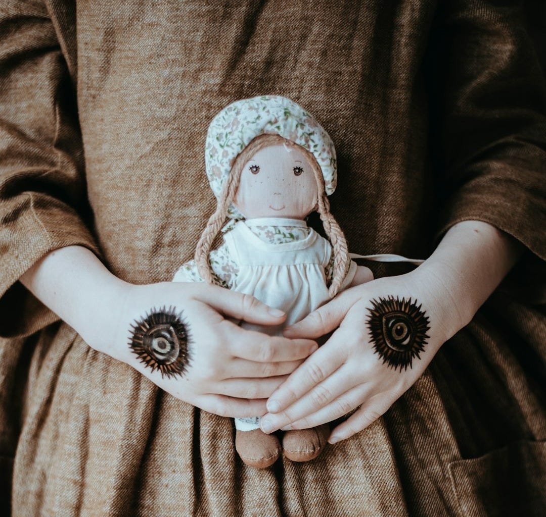 person holding Voodoo doll person holding Voodoo doll
