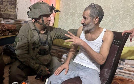 Hostage Farhan al-Qadi meets with the commander of the 162nd Division, Brig. Gen. Itzik Cohen, moments after being rescued from a tunnel in the southern Gaza Strip, August 27, 2024. (Israel Defense Forces)