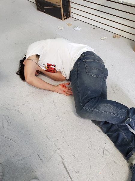 man bleeding out on floor of comic con 2019 for the boys