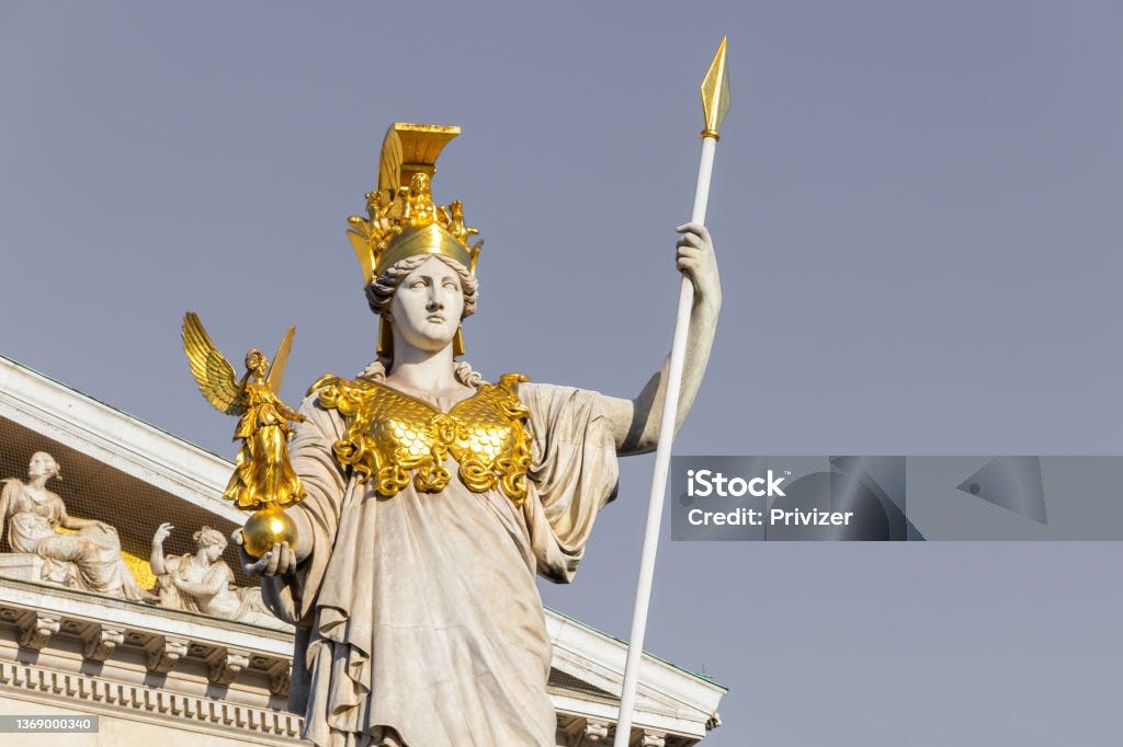 The ancient Greek Goddess Athena in front of Austrian Parliament Building Sculpture of Athena, the Greek goddess of wisdom,outside the Austrian Parliament Building in Vienna, Austria Athena - Greek Goddess Stock Photo