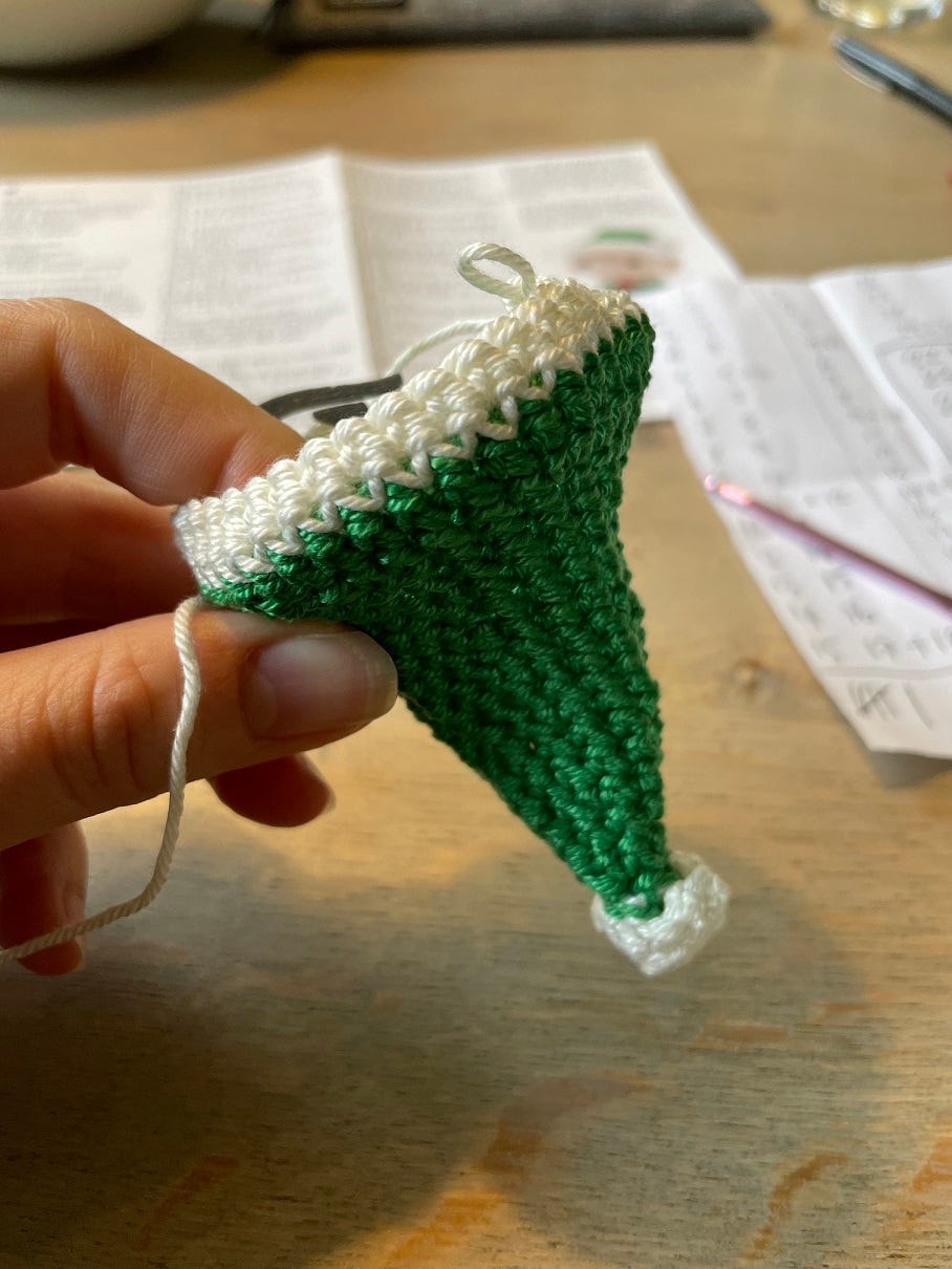Photo: crochet elf hat in green and white yarn